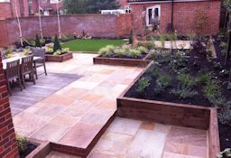 Award winning garden design with split level patio, lawn, planting beds and decking